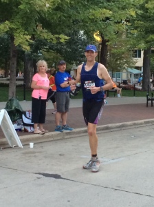 Here I am keeping up an Athletic Walk just past mile 13. I'm forcing a smile. 